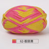 A ball of hand-dyed fabric strip yarn featuring pink and yellow stripes.