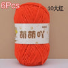 A skein of bright orange chenille yarn labeled 6 pieces and 10 large balls for crochet and knitting.