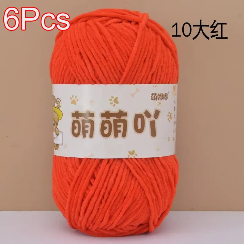 A skein of bright orange chenille yarn labeled 6 pieces and 10 large balls for crochet and knitting.
