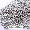 A pile of silver metallic beads, 3x6mm size, for jewelry making.
