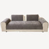 A modern sofa featuring light beige trim and charcoal gray chenille cushions.