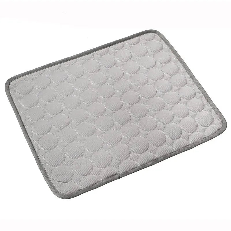 Gray quilted cooling ice mat designed for pets.