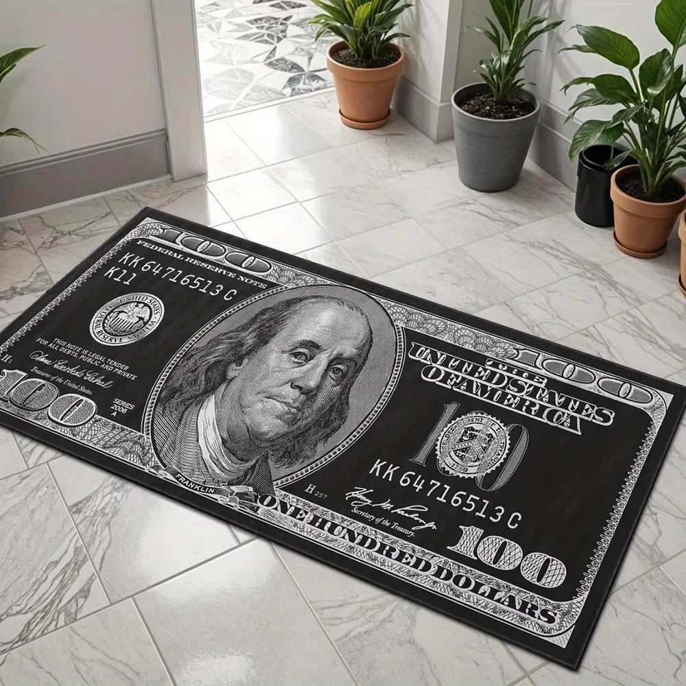A black imitation hundred dollar bill is laid on a white tile floor next to potted plants.