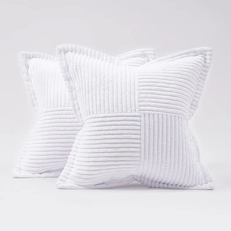 A white striped corduroy lumbar support pillow cushion shown in a close-up view.