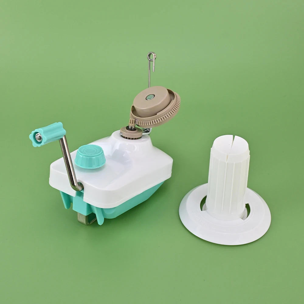 A hand-operated wool yarn winder device with a white and teal body and a white winding spool.