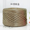 A ball of metallic gold cake yarn used for crafting.