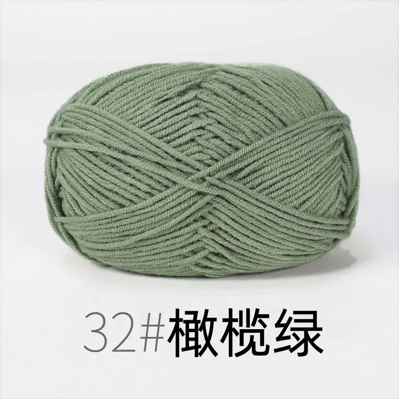 A ball of olive green organic cotton 4ply knitting yarn.