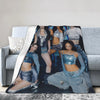 A cozy fleece throw blanket draped over a sofa, featuring a collage of K-Pop inspired models.