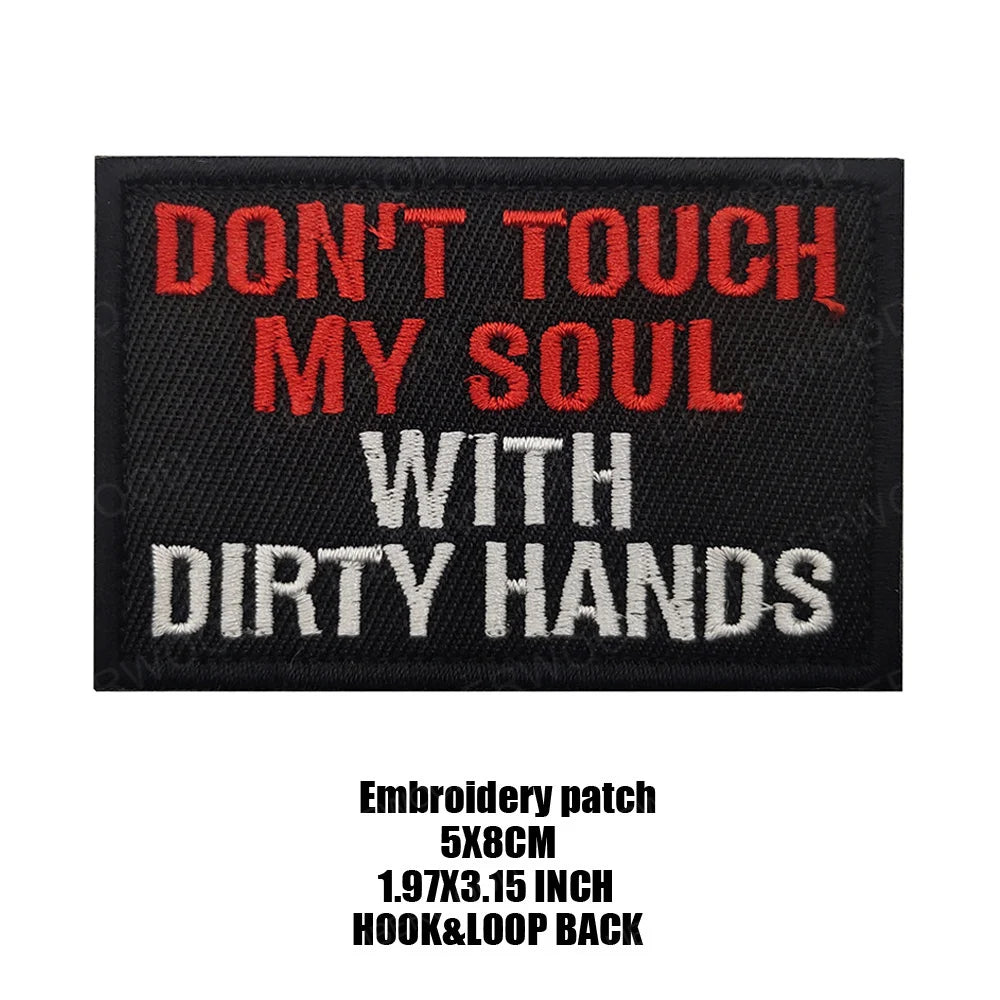 Black embroidered patch with red and white text that reads Don't touch my soul with dirty hands