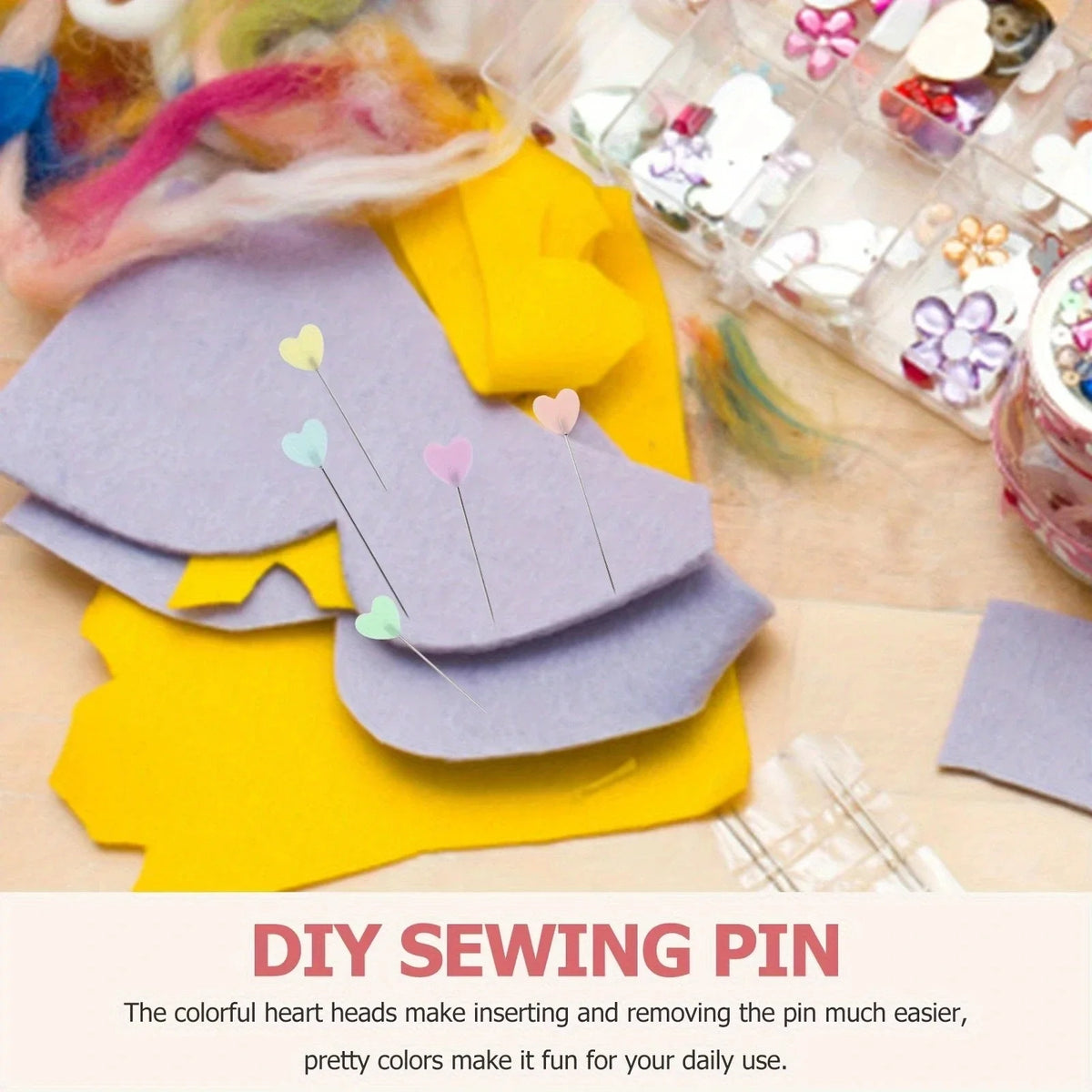 A collection of colorful heart-shaped sewing pins in various shades of purple and yellow on a wooden surface.