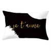 Black pillow cover with white text that reads je t'aime