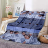 A blue and white fleece throw blanket featuring a collage of Stray Kids members' faces.