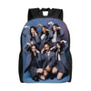 A dark blue canvas backpack featuring illustrations of five young women in school uniforms.