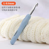 A silver L-8.0mm crochet hook is shown resting on a ball of cream-colored yarn.