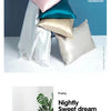 A collection of silk pillowcases in various shades including pink, teal, and silver, displayed on a white background.