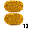 A ball of thick, golden yellow velvet yarn with a woven pattern.