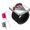 Silver magnetic wrist pincushion with a silicone band and various colored pins