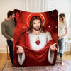 A large canvas print depicting a portrait of Jesus with a halo and a Sacred Heart, set against a red background.