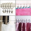 Flexible bendable curtain track with metal hooks and various colored fabric for hanging curtains