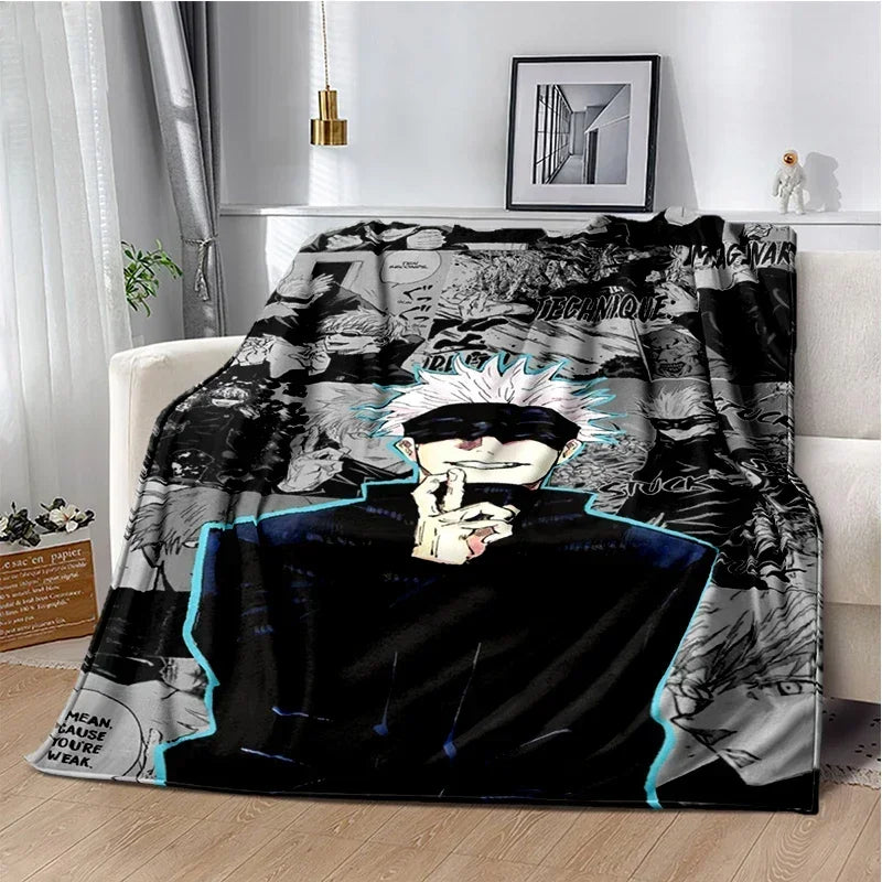 A black and white graphic throw blanket featuring an anime character with spiky white hair and a dark outfit.