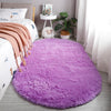 A vibrant purple plush floor mat placed on a light gray floor in a bright room.