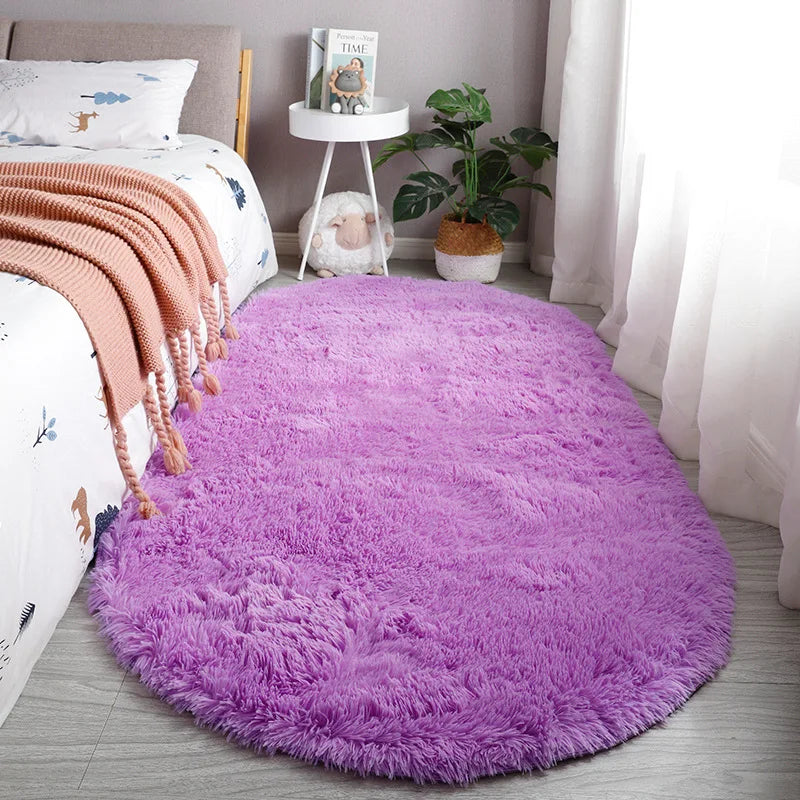 A vibrant purple plush floor mat placed on a light gray floor in a bright room.