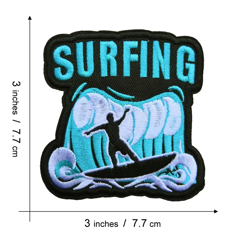 Black and blue embroidered patch featuring the word SURFING above a stylized blue wave and surfboard.