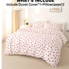 White duvet cover set with a red heart print and two matching pillowcases displayed on a bed.