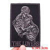 A black embroidery patch depicting a detailed skull and skeletal structure for clothing.