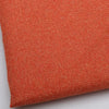 Close-up of coarse orange linen and cotton fabric texture.