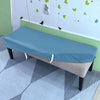 A light blue stretch pu leather waterproof bench slipcover placed on a wooden bench in a bright room.