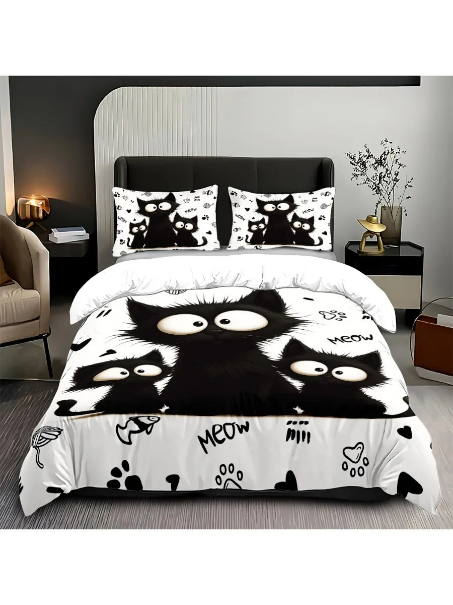 A black and white cat print bedding set featuring multiple cats on a duvet cover and pillows.