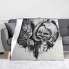 A flannel throw blanket featuring a distressed Chucky horror movie character design.