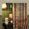 A close-up of ornate, sheer curtains with gold floral embroidery in shades of bronze and deep teal, set against a dark wood c