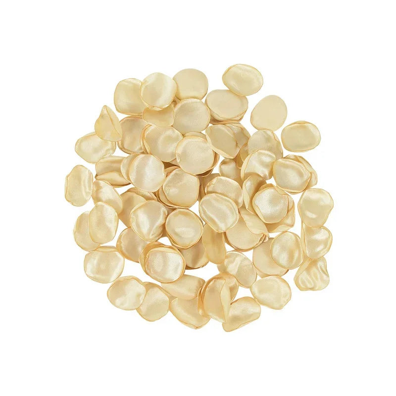 A pile of pale yellow silk rose petals for weddings and events.