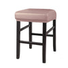 A bar stool with a pink upholstered seat and black wooden legs.