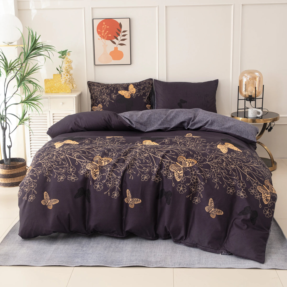 A dark purple butterfly print duvet cover set displayed on a bed with white and gold accents.