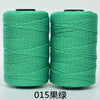Spool of bright green hand knitting and crochet cord for crafting