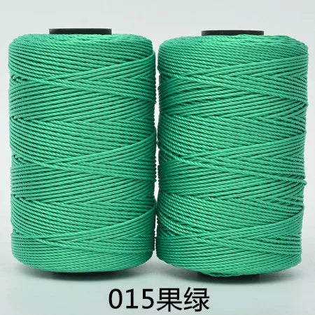 Spool of bright green hand knitting and crochet cord for crafting
