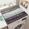 A laundry room appliance covered with a wooden grain mat engraved with Wash Dry Fold Repeat