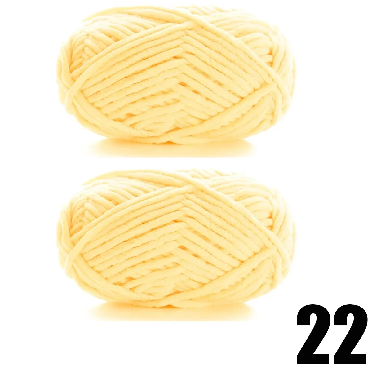 A ball of thick, pale yellow velvet yarn with a chevron pattern.