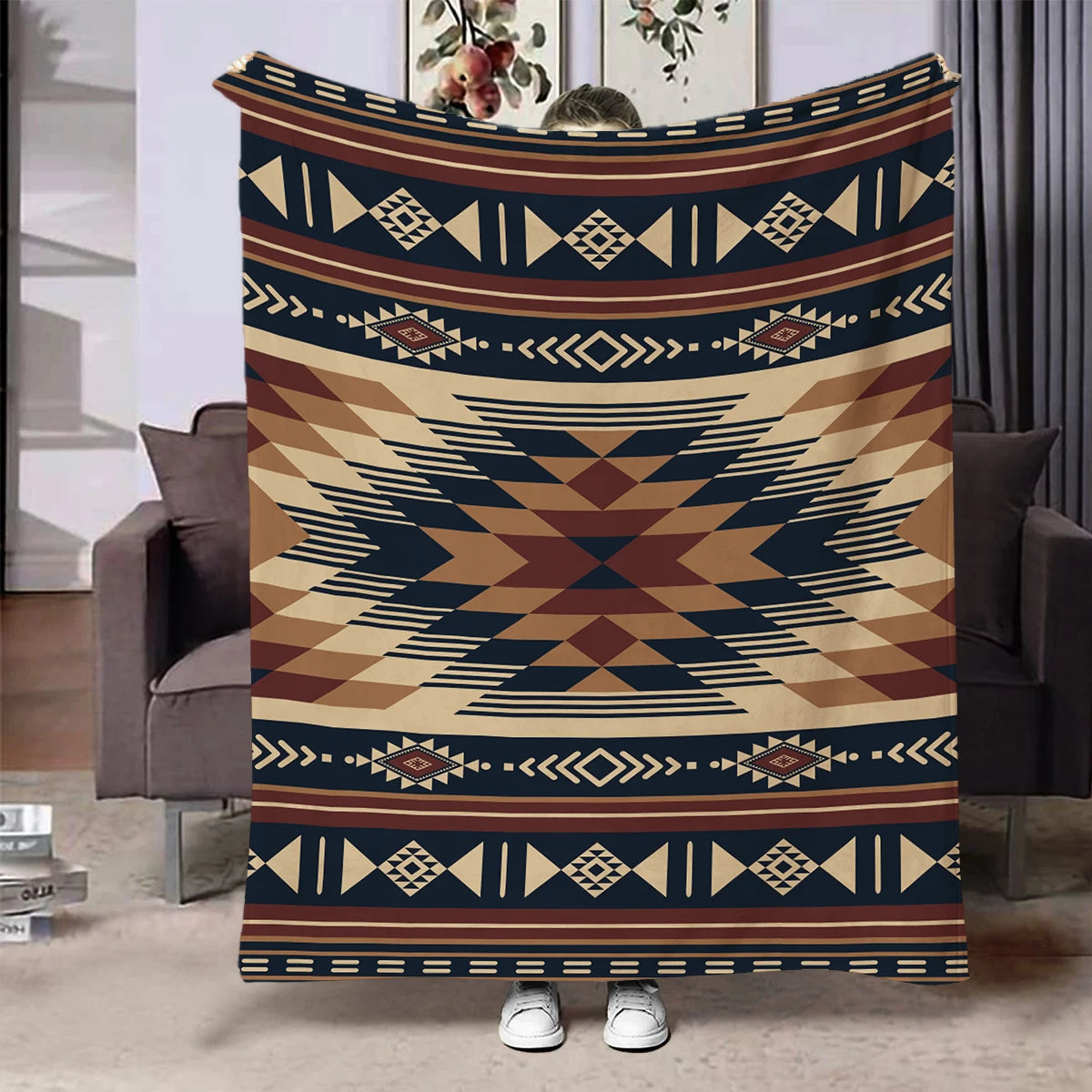 A rectangular throw blanket featuring a geometric ethnic print in shades of brown, beige, and navy blue.