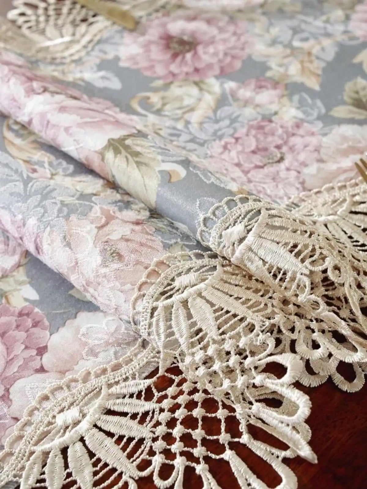 Elegant jacquard lace table runner featuring floral patterns and delicate white lace trim.
