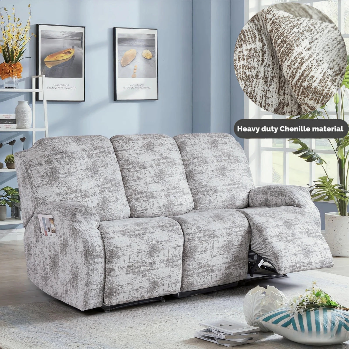 A gray heavy-duty chenille recliner sofa slipcover is displayed indoors with decorative art and plants.