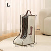 A beige waterproof foldable boots storage bag with brown accents is shown on a light rug.