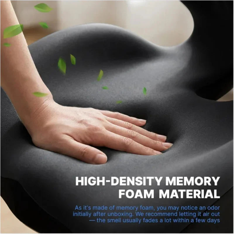 A hand rests on a dark gray memory foam cushion, demonstrating the texture and support of the material.