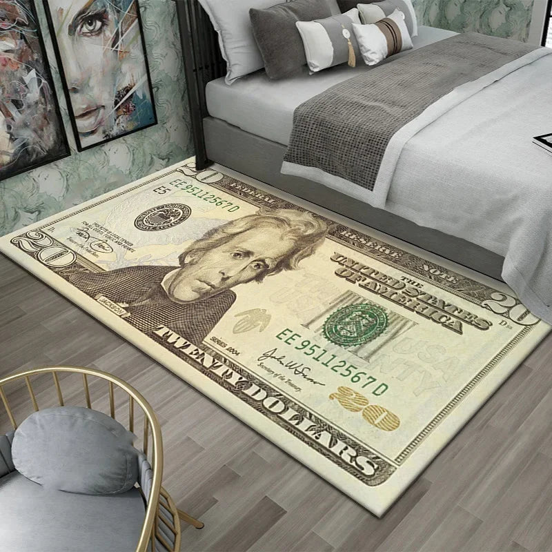 A close-up of a large dollar print anti-slip area rug placed on a wooden floor next to a bed.