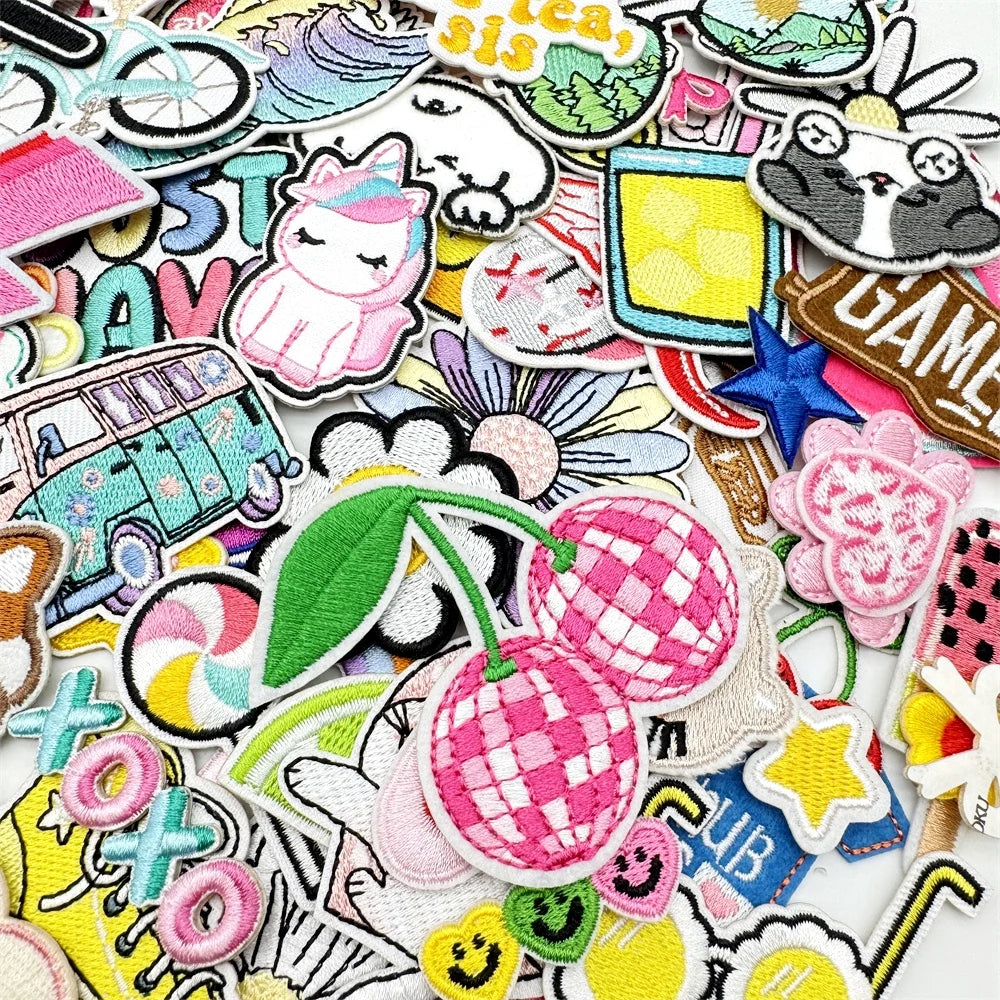 Assorted cartoon embroidery patches featuring various animals, food items, and abstract designs for DIY projects