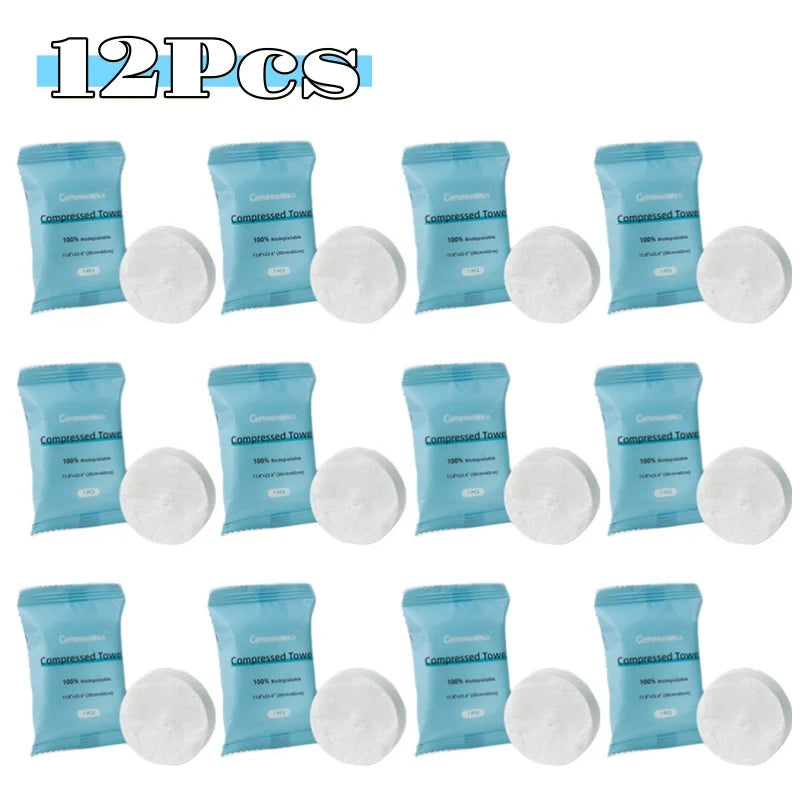 A pack of 12 disposable compressed fiber face towels in blue packaging.