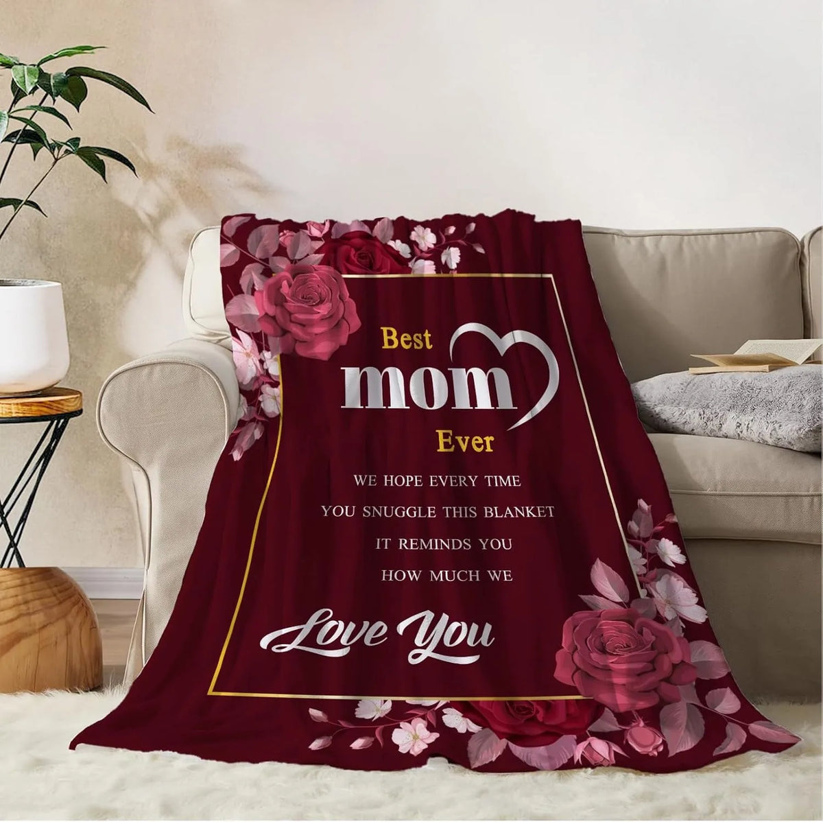 A deep red throw blanket featuring a floral pattern and the text Best mom Ever Love You